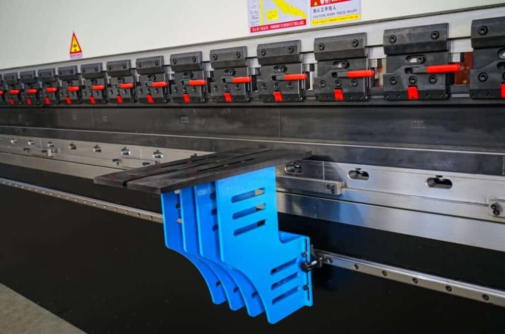 a blue plastic pieces on a metal machine