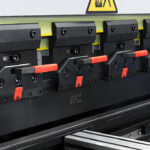 Overview of a quick style press brake clamping system mounted on the upper beam