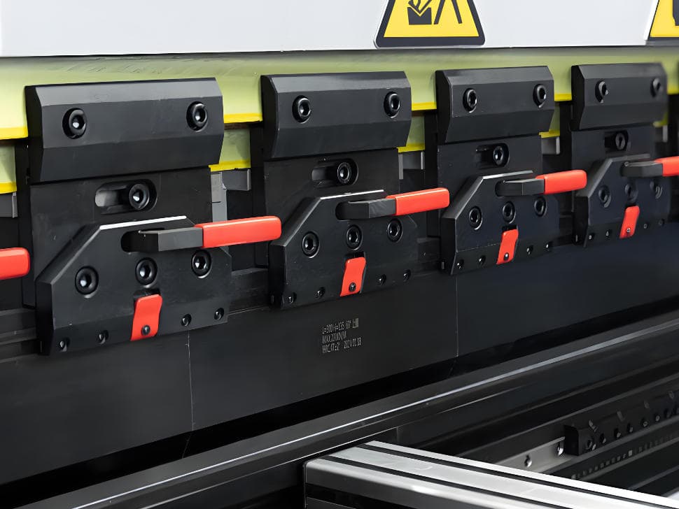 Overview of a quick style press brake clamping system mounted on the upper beam
